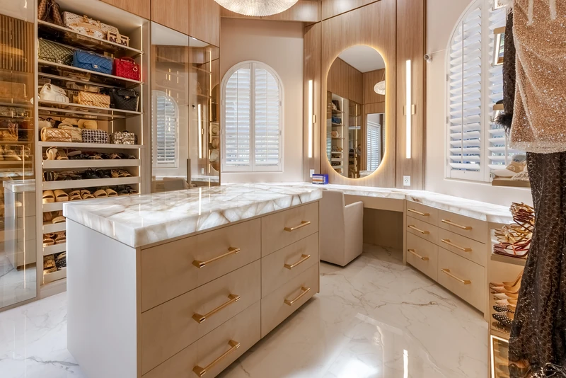 Custom walk-in closet · Integrated vanity, drawer storage, and display shelves