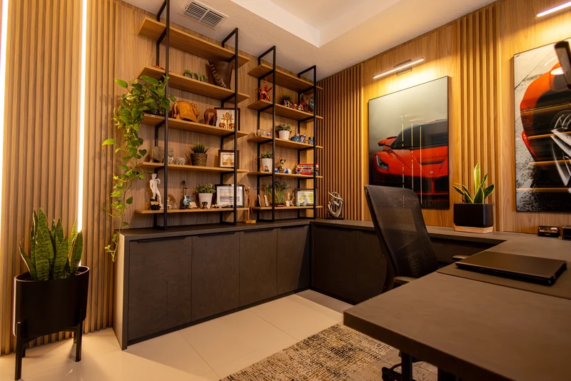 Home office · Custom shelving, warm wood panels, and integrated lighting.